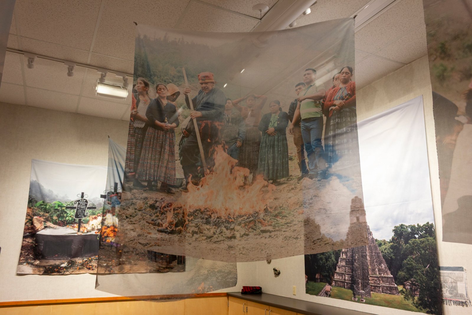 Ceremony with fire — color sublimation on polyester, with Tikal pyramid and graves visible behind