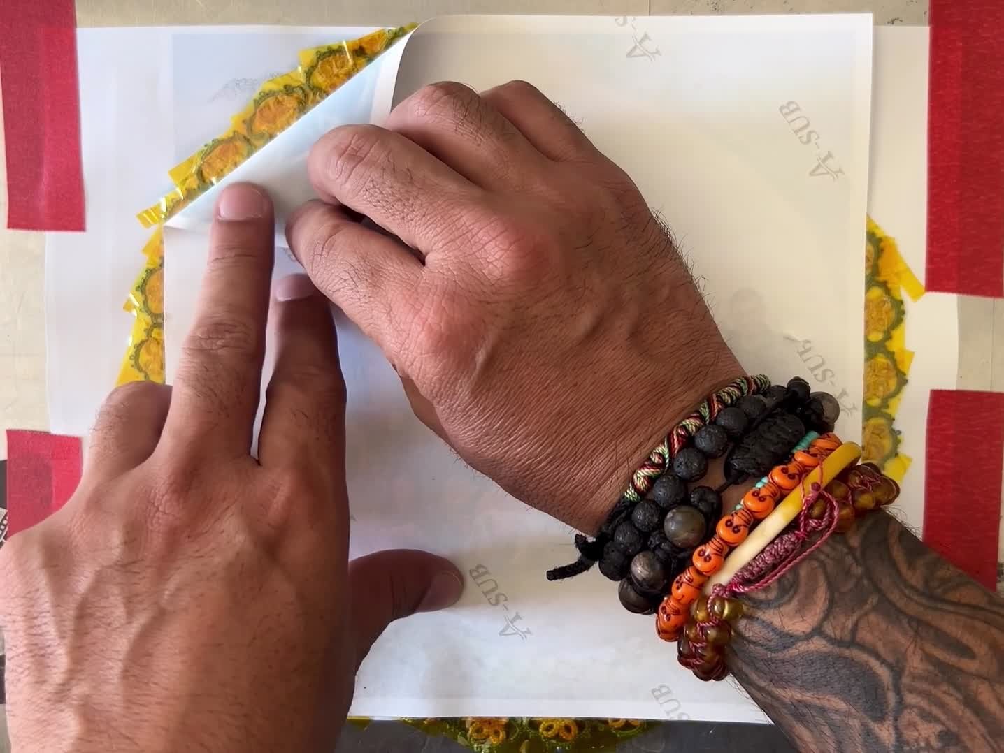 Post-sublimation reveal — peeling back the transfer paper from Smoke Offering · Queja, Guatemala · sublimation on inherited cotton lace