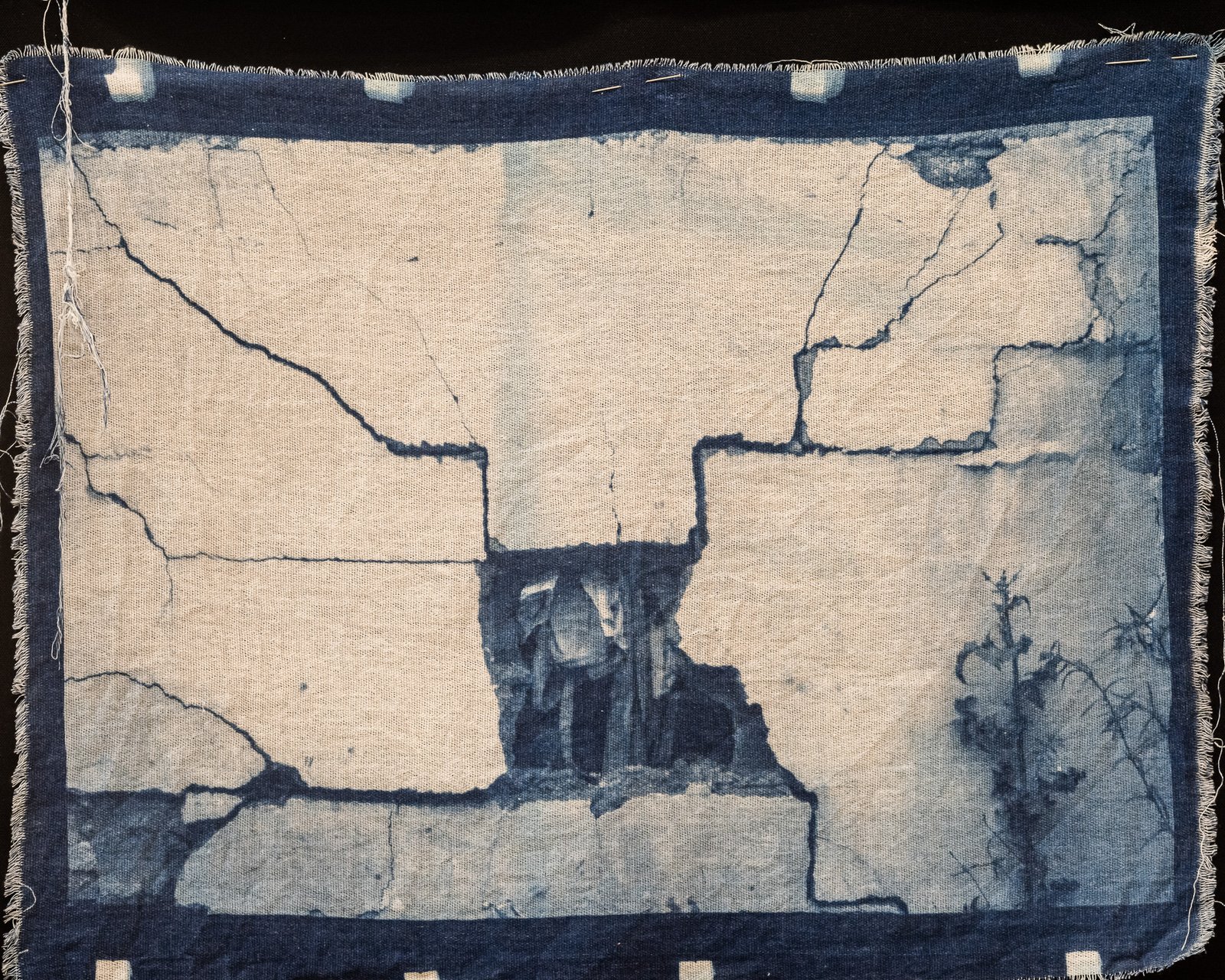 Cracked wall opening over the village — cyanotype on cotton